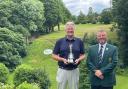 Richard Wheatley (left) lifts the Bradford Open trophy at Northcliffe Golf Club alongside Union president Mark Buckley. Picture: Matthew Stanworth.