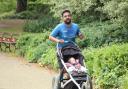 Emon Choudhury (pictured) running with his daughter in a pushchair as he prepares to take on the London Marathon