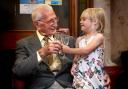 Cheers! Donald, with a glass of fizz, celebrates with great granddaughter Olive, with lemonade