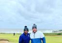 Jordan Clements (right) with his practice round partner Anirban Lahiri on Monday at Royal Porthcawl.