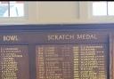 Max Berrisford pictured next to the 'Club Scratch' leaderboard at Ilkley Golf Club