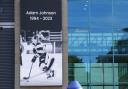 A message board with a tribute to Nottingham Panthers’ ice hockey player Adam Johnson outside the Motorpoint Arena in Nottingham