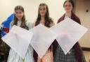 These three girls dressed up as the the Brontë sisters and flew kites over Penistone Hill in memory of victims killed in Gaza.
