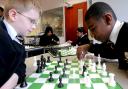 Josh Haulbrook and Tyrone King play with one of the new chess sets at Tong High School, 2008s sets, 2008