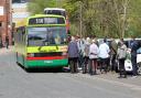 Visitors board a bus at the open day for a town tour