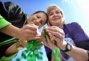Asda’s Ingrid Fernandes (left) and Victoria Collins, from the University of Bradford, with green coin tokens