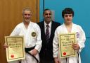 BLACK BELTS: Paul Ellen and Rory Gallagher with Mo Ilyas