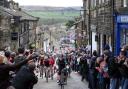 Riders scale the iconic Main Street in Haworth during a previous year's Tour de Yorkshire..