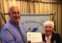 Steve Seymour receives the Paul Harris Fellowship from Keighley Rotary Club president Marie Hickman