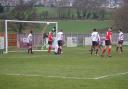 Joe Gaughan (out of picture) fires home Silsden's equaliser Picture: David Brett