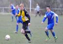 Wibsey's Jamie Brennan (black and yellow) scored in his side's 2-0 Premier Division win over Stanningley Old Boys Picture: Tom Smith