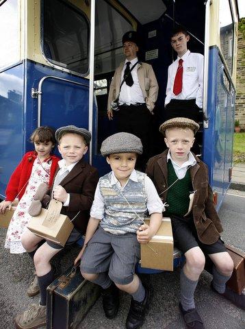 Evacuees find themselves in Haworth. From the left, Zara Beale, Leo Beale, Adam Beale, Elliot Beale with bus staff Warren McClintoch, left, and Franklin Stansfield.