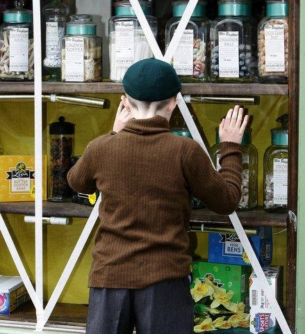 One young visitor finds the sweetshop very tempting.