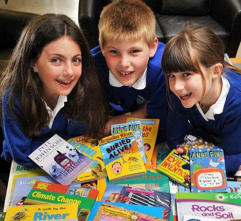Addingham Primary School’s library has been stocked with over 500 new books as part of Bradford Council’s Ward Investment Project Fund.
Pictured with some of the new books are, from the left, Amelia Gawtry, 11, Ethan Copping, 11, and Lucy Millington,
