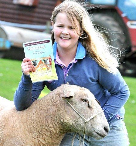 Georgina Hobson has two reasons to be looking forward to this weekend’s 201st Otley Show.
The ten-year-old designed the cover for this year's programme and her family is entering five charollais rams into the sheep classes.