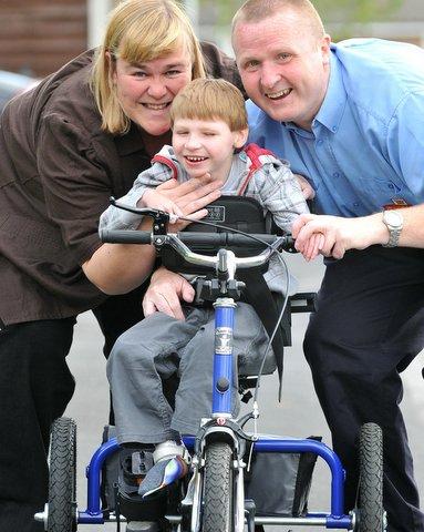 The parents of a severely-disabled boy have thanked local people who have rallied round to help their son.
They have all chipped in to buy a special trike which will help Jack’s body to develop. 