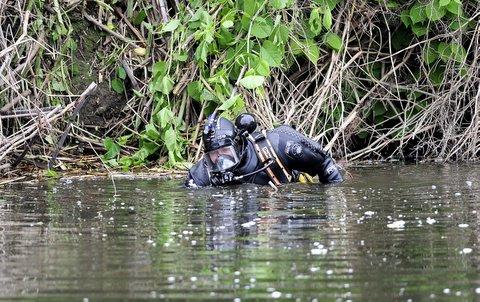 Police forensics teams and frogmen during the search around Shipley and the Riiver Aire for the missing prostitutes.