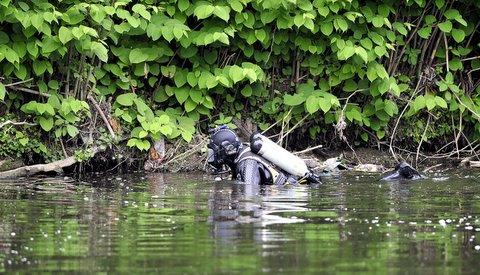 Police forensics teams and frogmen during the search around Shipley and the Riiver Aire for the missing prostitutes.
