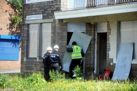 Police search derelict buildings in the red light district on Chain Street, Bradford, known locally as 'Death Row'.