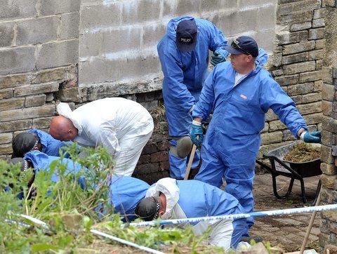 Police search behind Holmfield Court in Thornton Road.