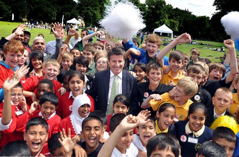 Hundreds of Bradford schoolchildren waved and cheered as two times gold medal winner Sebastian Coe arrived in Lister Park to meet youngsters who have been inspired by the 2012 London Olympics. 