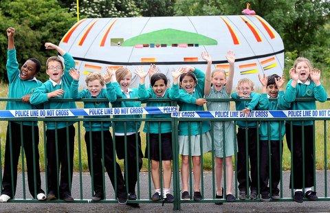 Children arrived at school to an astonishing sight – an alien spacecraft had landed next to their playing field. 
Staff at Newhall Park Primary School Bierley, had staged an alien landing for pupils before asking them to help the authorities find them.