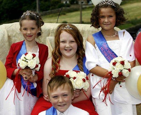 Oakworth Gala Queen Leah Barrett, centre, is joined by page Charley Smith and attendants Lexie Allsopp, left, and Lauren Thompson at the village's annual event.