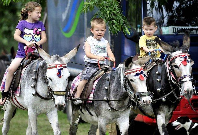 About 2,000 people were at the Baildon Carnival opened by MP Philip Davies and carnival queen Amy Barry. Among the attractions were donkey rides, here being enjoyed by from the left, Courtney Smith, Bradley Smith and Alfie Dyer.