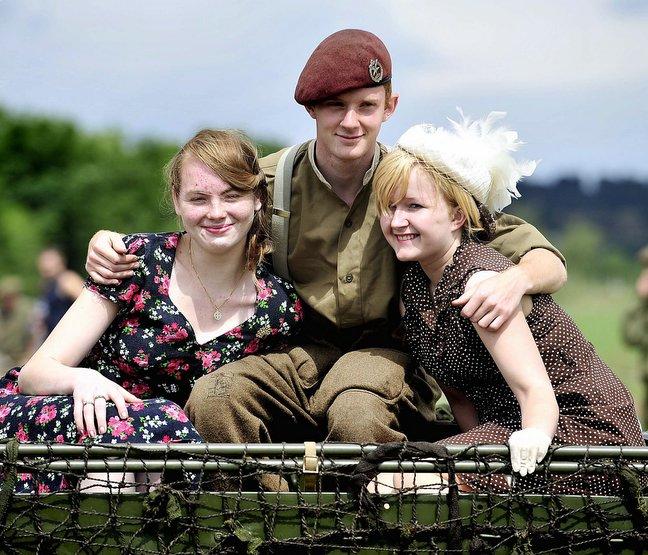 Visitors’ eyes turned skywards as a magnificent World War II Dakota aircraft flew over a tourist attraction as part of a 1940s-themed weekend at Heckmondwike. Joining in the fun were , from the left, Charlie Huxley, Jack Tilt and Lysette Hacking.