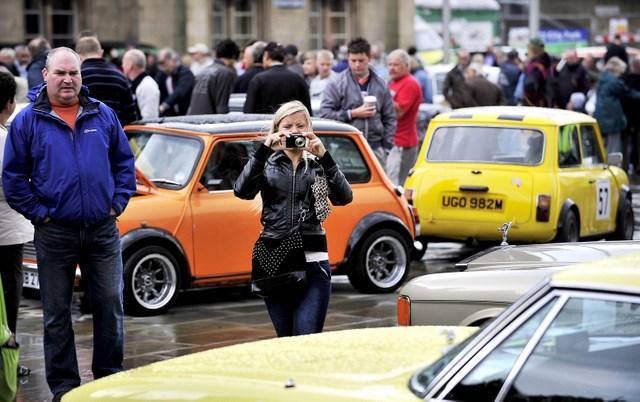 Visitors look at the vintage cars on display at the Bradford Classic 2010 event in Centenary Square