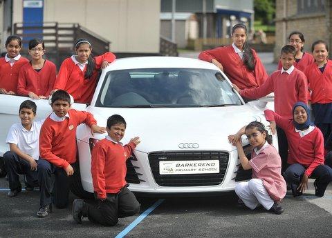 Youngsters at Barkerend Primary School were treated to a taste of life in the fast lane when a new Audi R8 pulled up at the school gates. 
