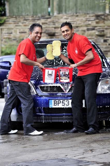 Heaton councillors Imdad Hussain (on the left) and Rizwan Malik (right) prepare to get stuck in to a charity car wash to raise money for the Pakistan flood aid appeal.