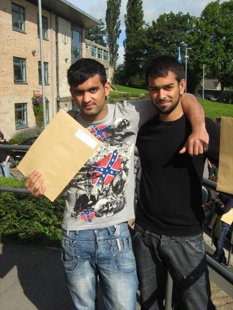 Bilal Arshad and Kamran Khan pick up their results at the Greenhead/Holy Family associated sixth form