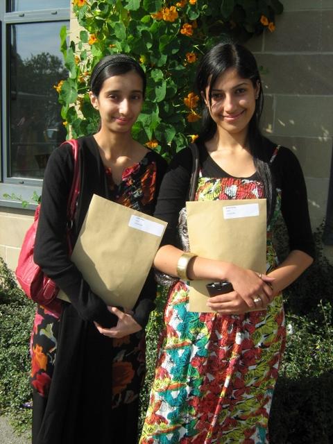 Falak Ghani and Komal Pervez, students at the Greenhead/Holy Family associated sixth form, with their A-level results