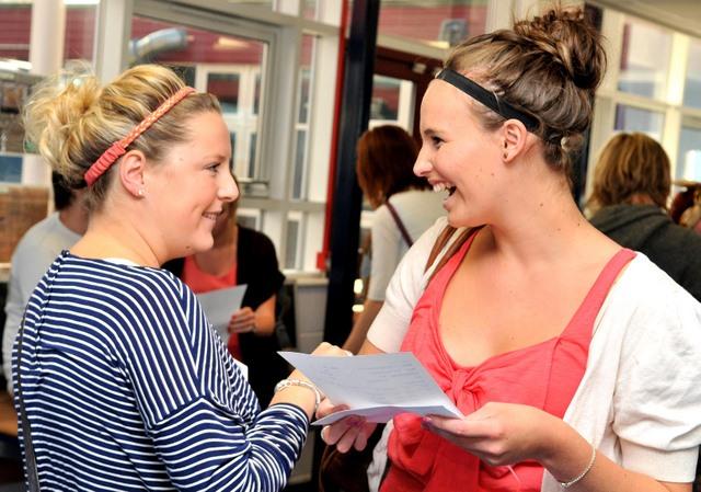 Rosie Davies smiles as she opens her A-level results at St Marys Catholic School in Menston