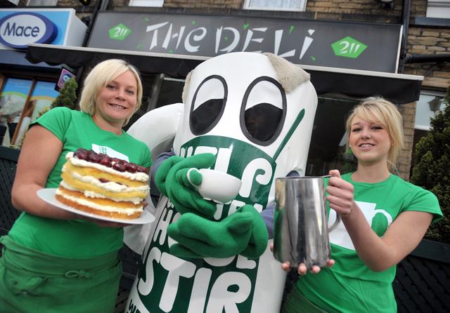 Catherine Mason (left) and Chloe Lightowler from The Deli in Bingley Road, Saltaire, with the Macmillan Cancer Care World’s Biggest Coffee Morning mascot