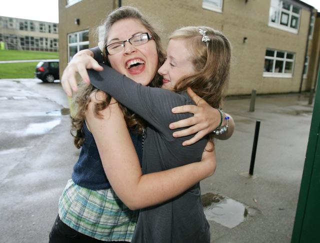 High Achievers Emily Williamson, who was awarded seven A* and five A grades, and Millie Whitaker, who got 14 A*s, celebrate together at South Craven School, Cross Hills