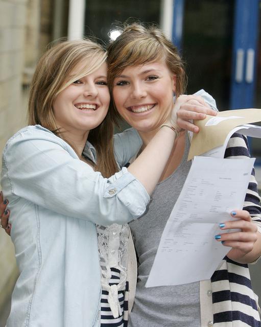 Lauren Brooks and Katie Holmes hug at Aireville School, Skipton, after collecting their results