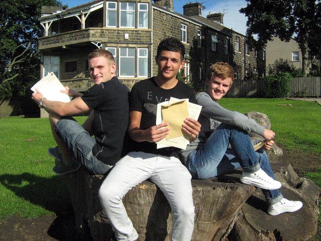 Richard Veazey, Sean Gill, and Luke Bayer with their results at South Craven School