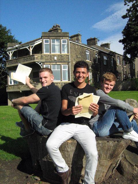 Richard Veazey, Sean Gill, and Luke Bayer with their results at South Craven School