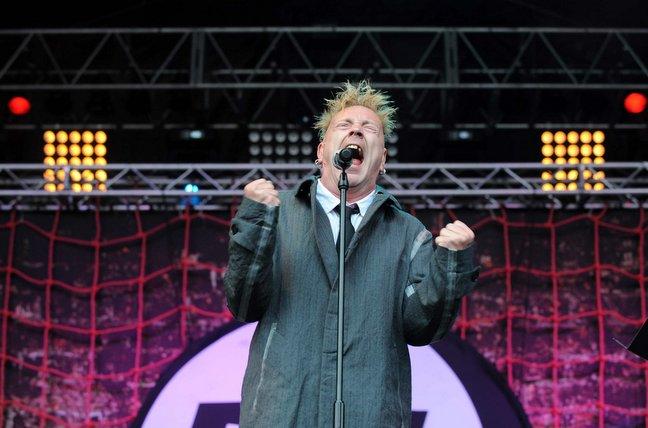 John Lydon on stage with his band Public Image Limited.
