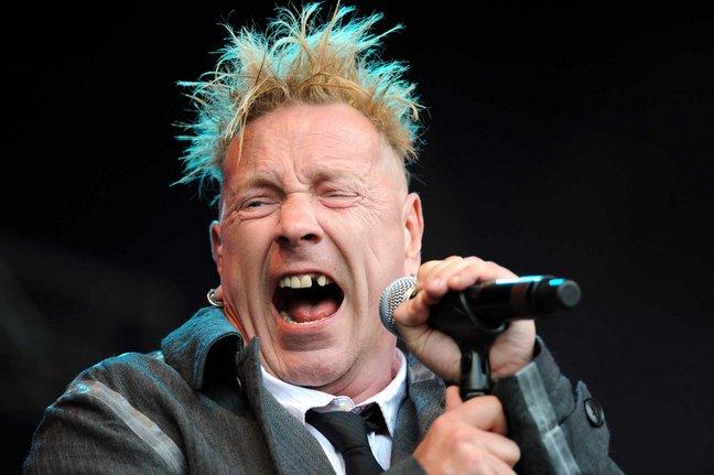 John Lydon on stage with his band Public Image Limited.