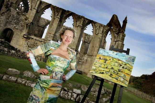 Artist Kitty North has hit upon a novel way to promote her work – by wearing a dress using images from her paintings. 
Kitty wore the special outfit for the opening of her exhibition in the brasserie and bar of The Devonshire Arms Hotel, Bolton Abbey.