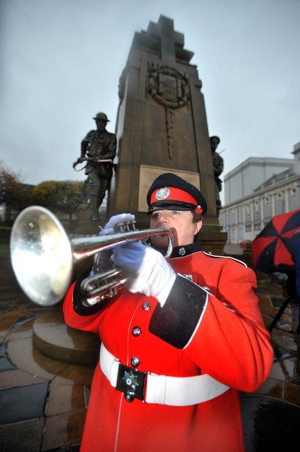 Louise Snape, from West Yorkshire Fire and Rescue Band, plays the Last Post at the Bradford cenotaph.