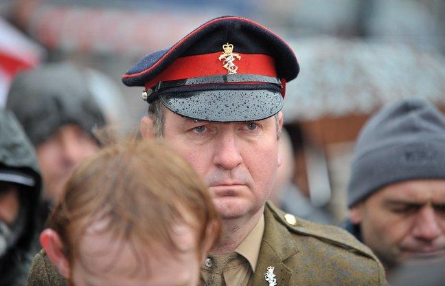 A serviceman pays his respects at Bradford.