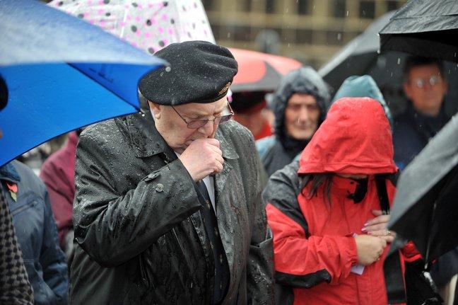 An old soldier remembers at the Bradford Cenotaph.