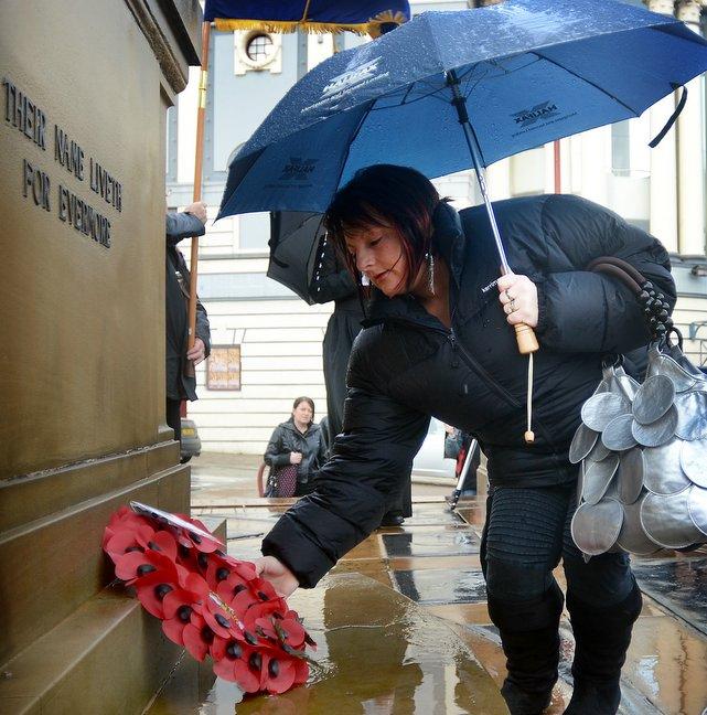 Wendy Rayner, the widow of Sergeant Peter rayner, who was killed in Afghanistan last month, lays a wreath at the Cenotaph in Bradford.