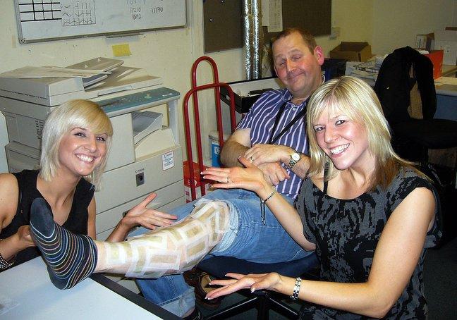 Getting in on the Children in Need fundraising act at the Telegraph & Argus was Robert Drummond who was among several gentleman 'volunteers' to have his legs waxed by Charlotte Wood, right, and Nicola Brannan.