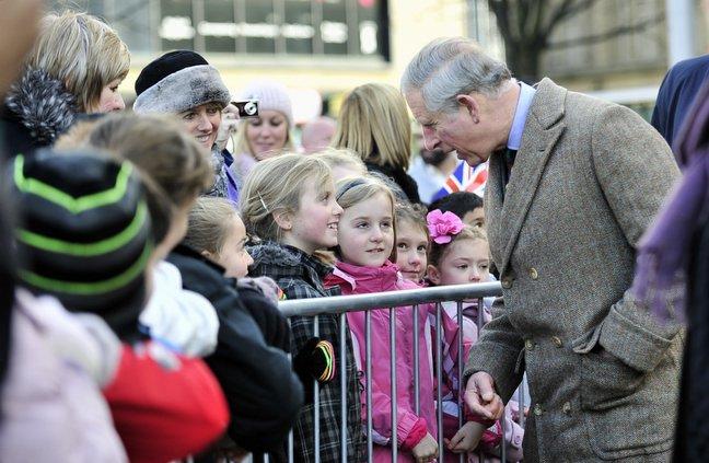 Prince Charles chats to youngsters on his arrival at City Hall in Bradford.