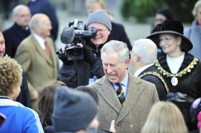 Prince Charles shares a joke as he arrives at City Hall in Bradford.